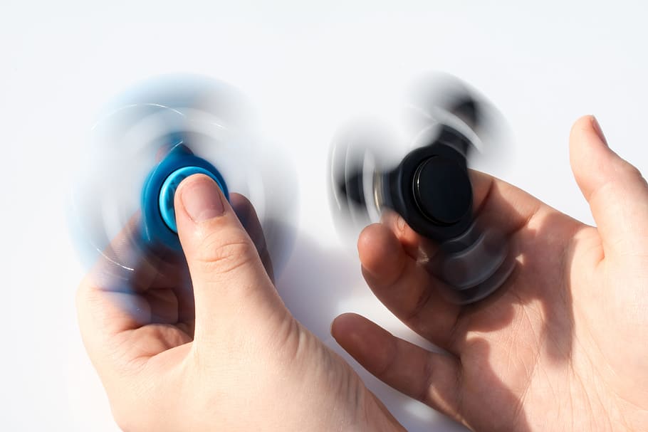 fidget spinners, various, hand, hands, stress, stressed, toy, toys, human hand, human body part