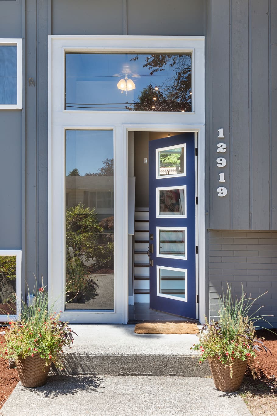 front door, 10 foot tall door, modern door, modern, mid century, blue door, entry, entrance, door, plant