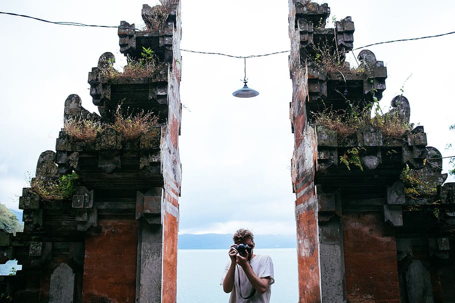 traveler photographer, clicking, pictures, temple, entrance, 20-25 year old, archaeology, architectural, architecture, carving
