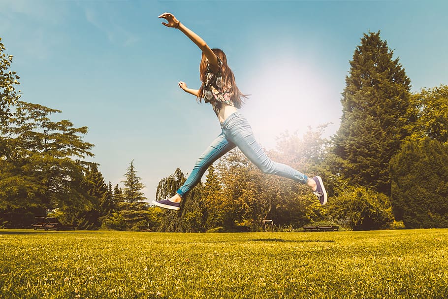 happy, young, girl, jumping, park, summer, mid-air, plant, tree, sunlight
