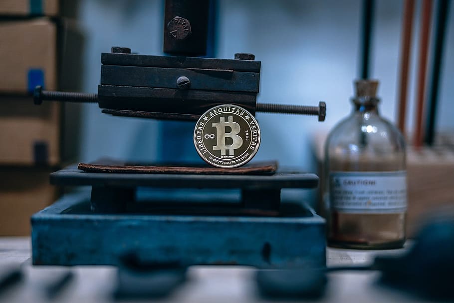 gold, plated, bitcoin, placed, rusty, machine, blur background, indoors, instrument of measurement, selective focus