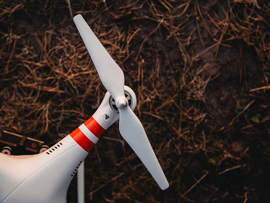 propeller, drone, focus on foreground, white color, nature, day, close-up, land, sharp, outdoors