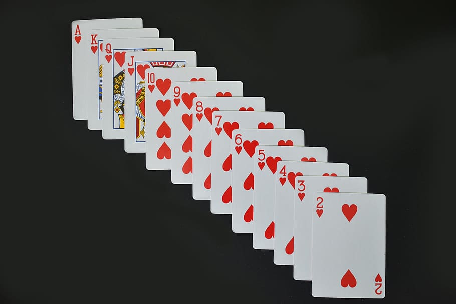 casino cards, various, gambling, magic, black background, red, studio shot, large group of objects, in a row, business