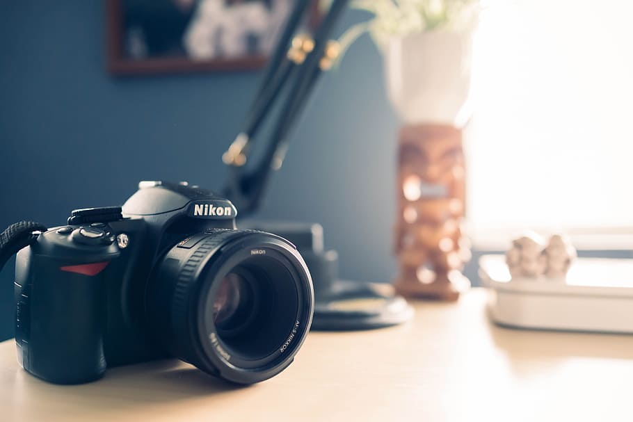 dslr camera, placed, office desk, blur background, background., items., camera - photographic equipment, technology, photography themes, lens - optical instrument