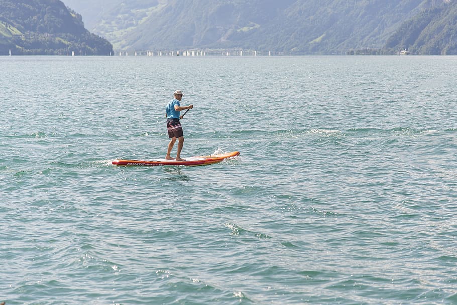 stand up paddle, water sports, paddle, paddle boarding, surfboard, water, one person, real people, waterfront, leisure activity