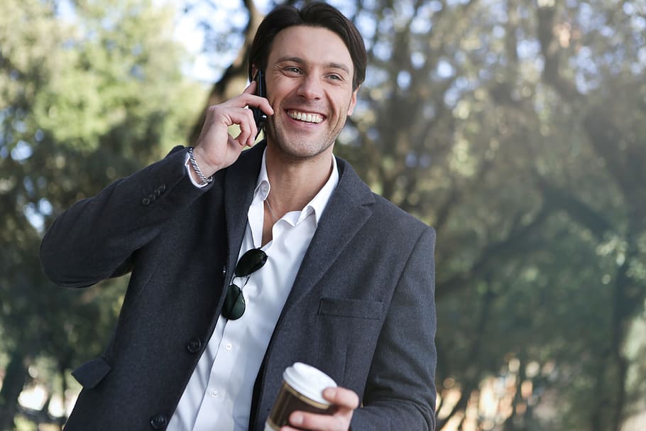 young, caucasian man, grey, coat, calling, mobile, phone, 30-35 year old, Adult, Collar