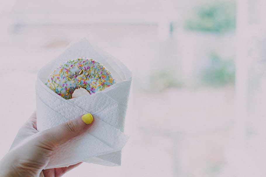 donut, sprinkles, hand, yellow, nails, wrapped, dessert, food, human hand, human body part