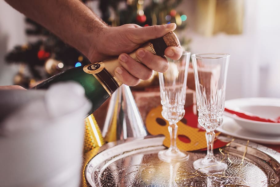 man opening champagne, room, decorated, christmas, human hand, glass, hand, refreshment, food and drink, drink