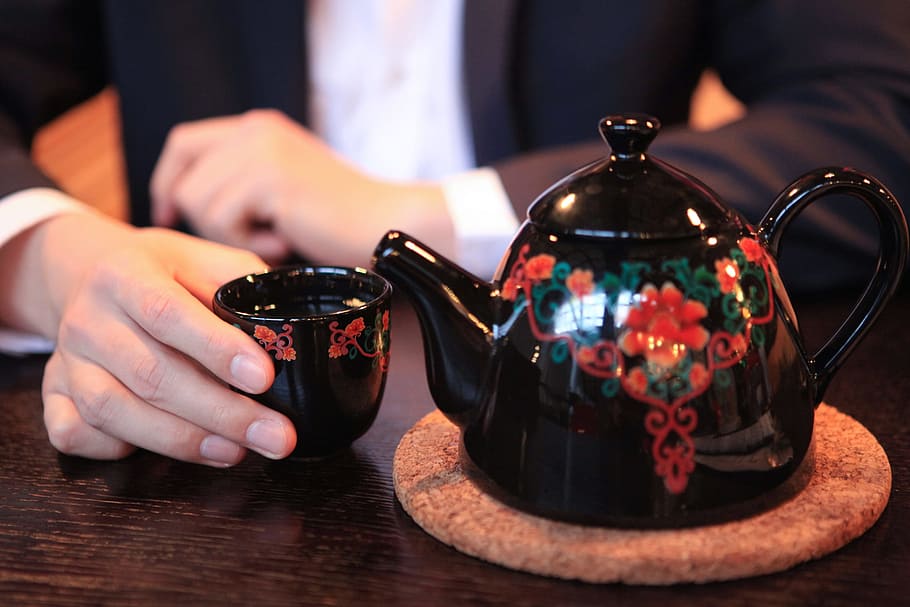 teapot, hand, close-up, human hand, human body part, one person, indoors, tea, tea - hot drink, hot drink