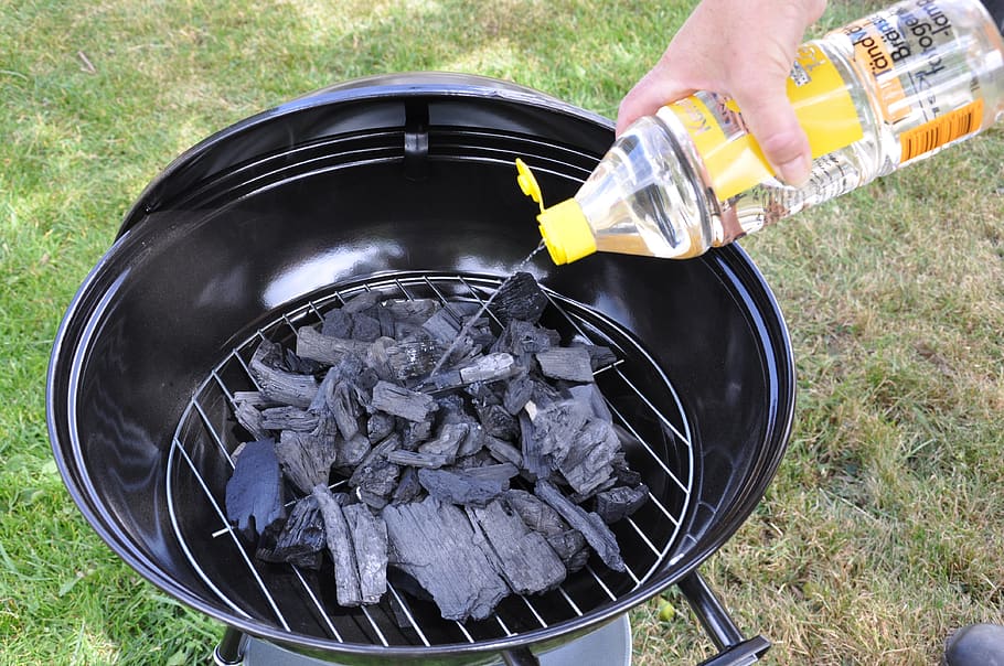 bbq, lighter fluid, ball grill, charcoal, light the grill, human hand, preparation, one person, holding, human body part