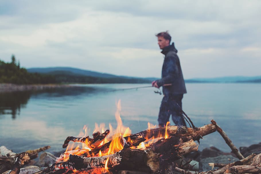 bonfire, fire, flames, camping, lumber, logs, young, guy, man, fishing rod