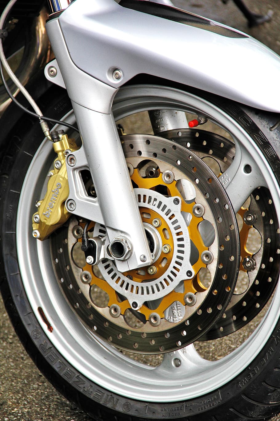 motorcycle, front wheel, two wheeled vehicle, brake, disc brake, brake disc, mature, vehicle, wheel, motorsport