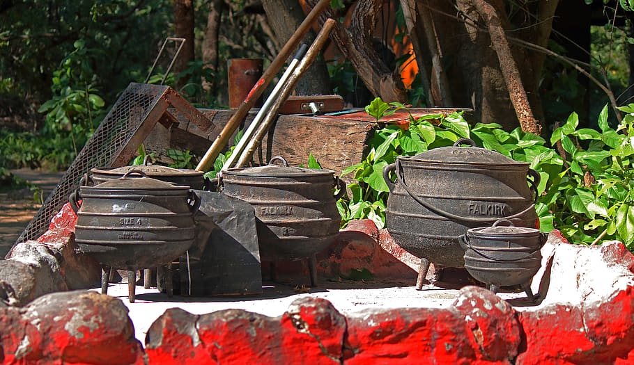 iron cooking pots, pots, three legged, iron, cast iron, black, outdoors, cooking, different sizes, africa