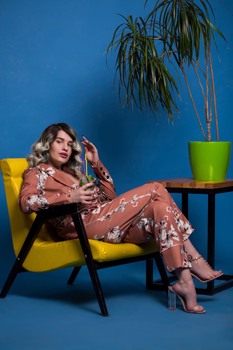 cool, woman, chilling, cocktail, yellow, chair, blue, wall, green, vase
