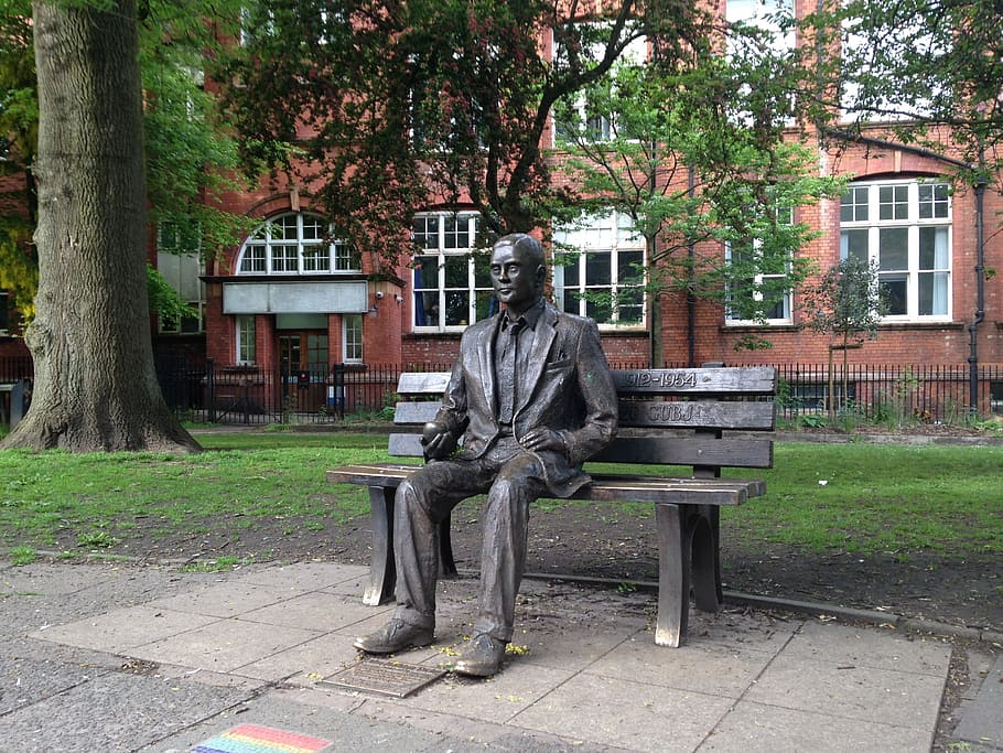 monument, alan mathison turing, wwii codebreaker, persecuted, sexuality., located, sackville gardens, adjacent, manchester, gay