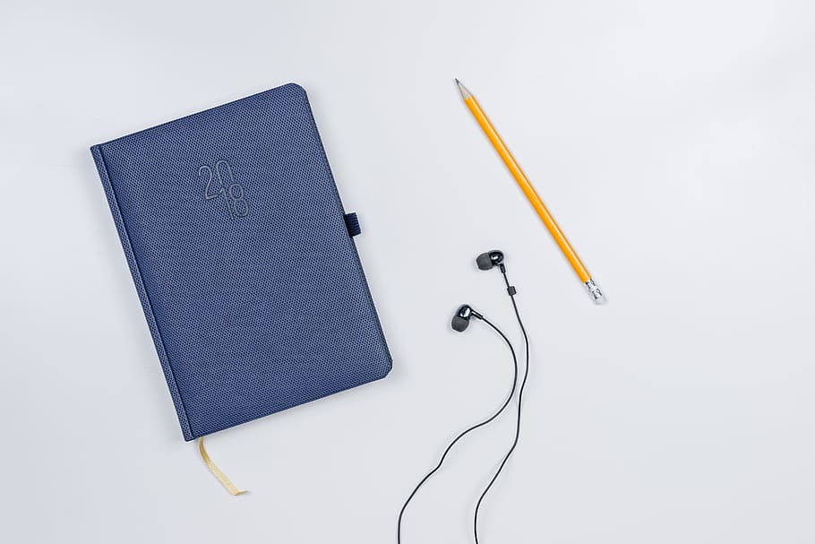 pretty, diary, pencil, headphones, white, table., white background, studio shot, indoors, high angle view