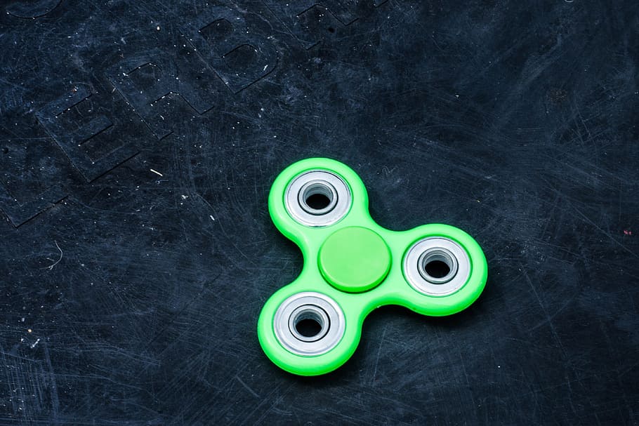 fidget spinner, various, stress, stressed, toy, toys, green color, indoors, close-up, still life