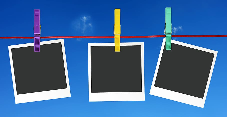 polaroid, suspended, clothes peg, blank, nylon cord, red, empty, picture frame, sky, blue