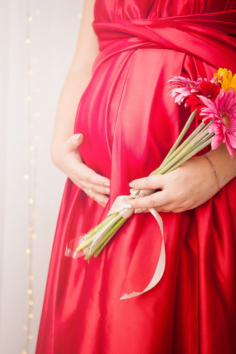 woman, grown up, lovely, pregnancy, belly, tummy, nice dress, flowers, hands, bouquet of flowers