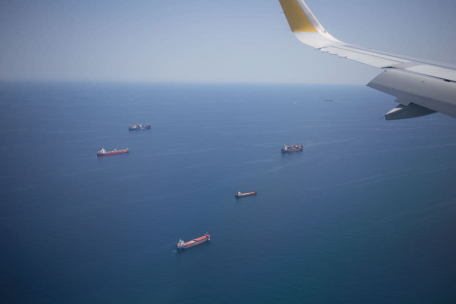 aerial, view, cargo ships, ocean, airplane window, aircraft wing, fame, airplane, freight, ship