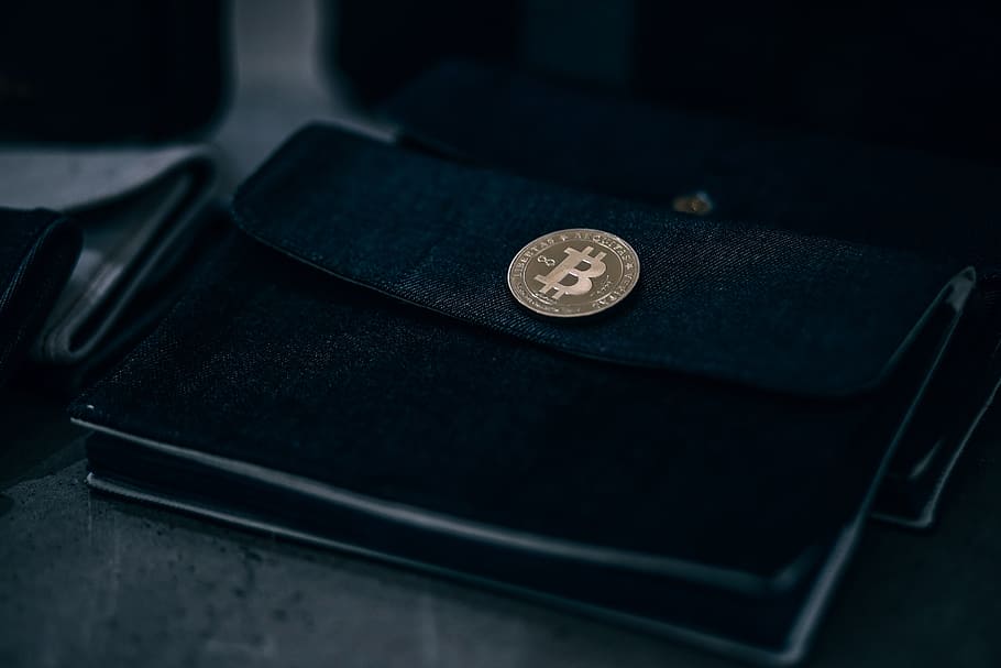 gold-plated, physical, bitcoin, black, wallet, inside, retail, store., close-up, indoors