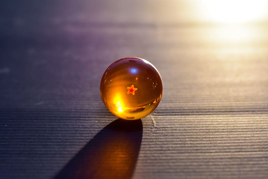 balls, dragon balls, toy, sphere, table, reflection, close-up, marbles, wood - material, glass - material