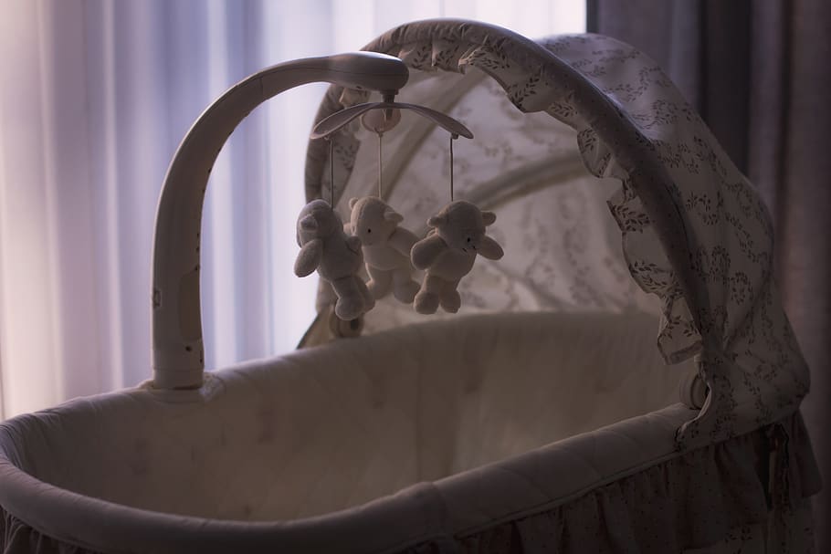 baby, crib, cradle, toys, indoors, focus on foreground, close-up, window, metal, curtain