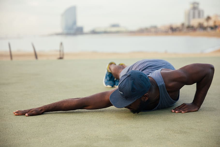 young, african man, wearing, casuals, stretching, 25-30 year old, Adult, African, Fit, One Person