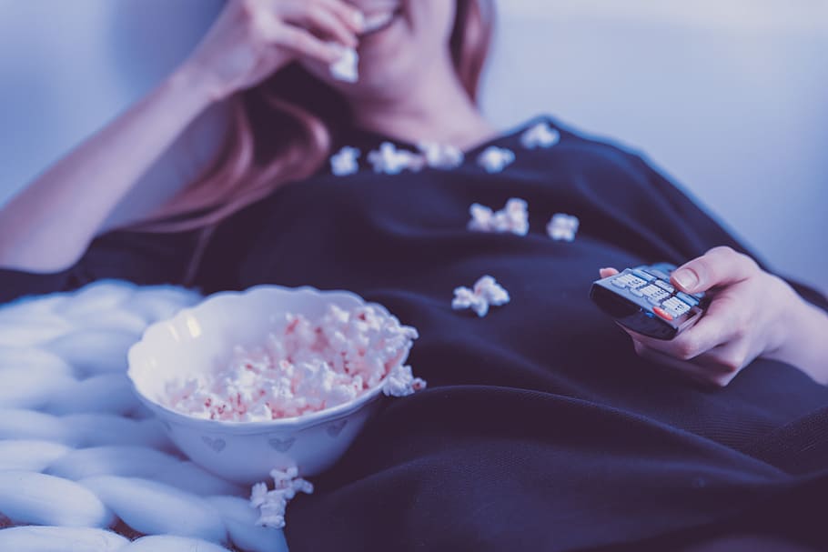 happy, woman, watching, tv, eats, popcorn, night, human body part, holding, one person