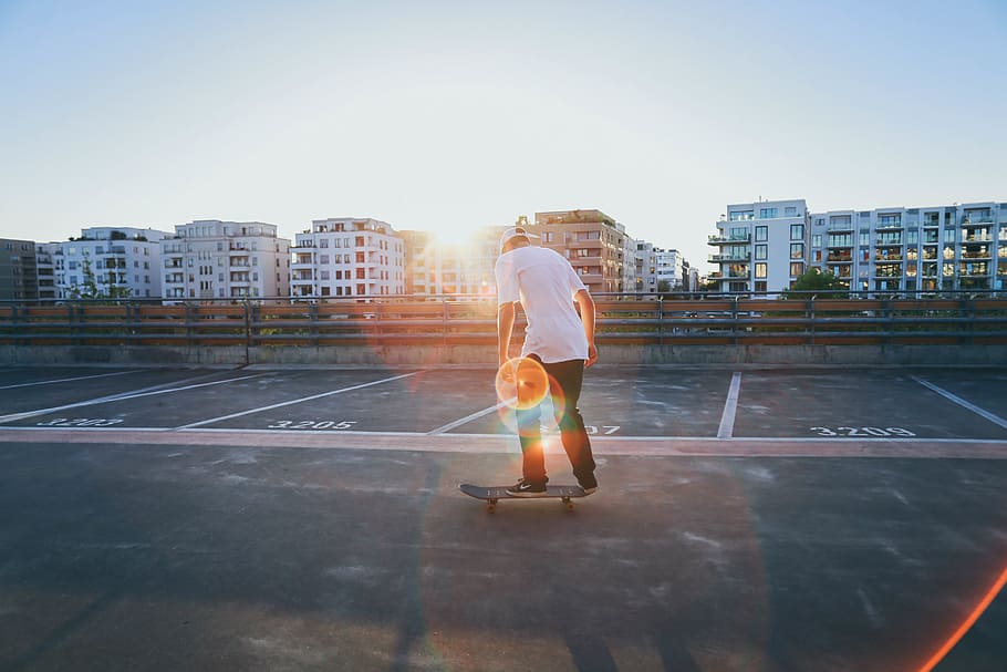 buildings, structure, condominium, people, man, skateboarding, sport, sunlight, sunshine, sunrise