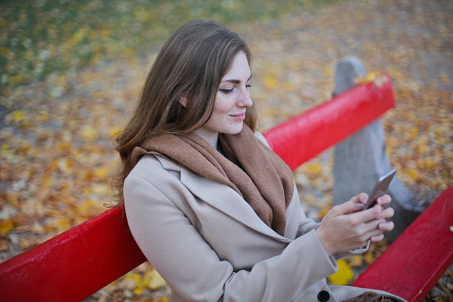young, woman messaging, mobile, phone, red, autumn park, 25- 30 years, Application, Beautiful, Bench