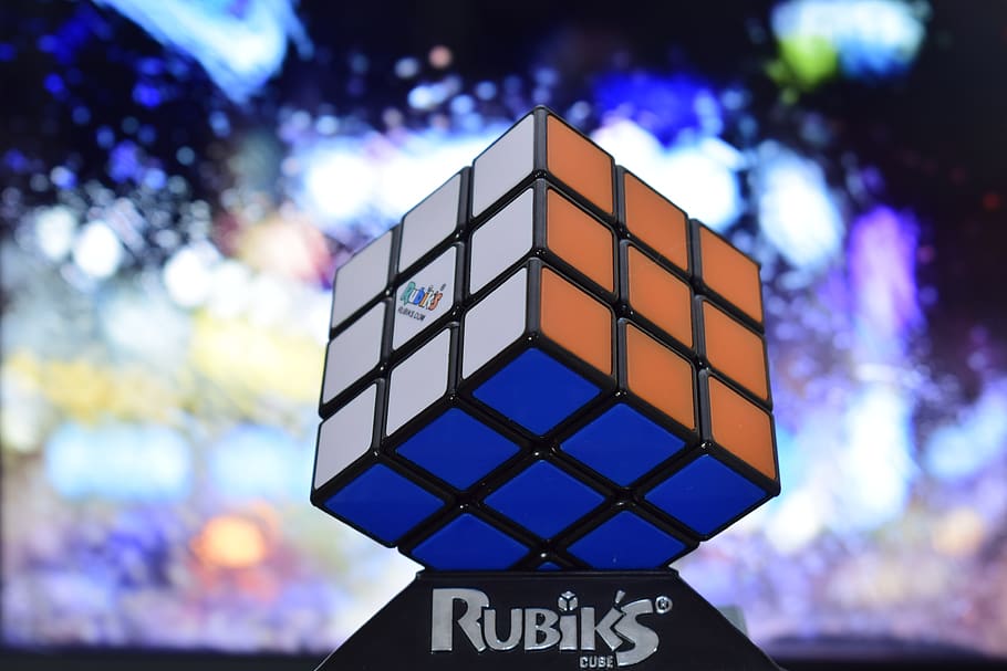 rubik's cube, cube, color, logic, communication, focus on foreground, text, sign, western script, outdoors