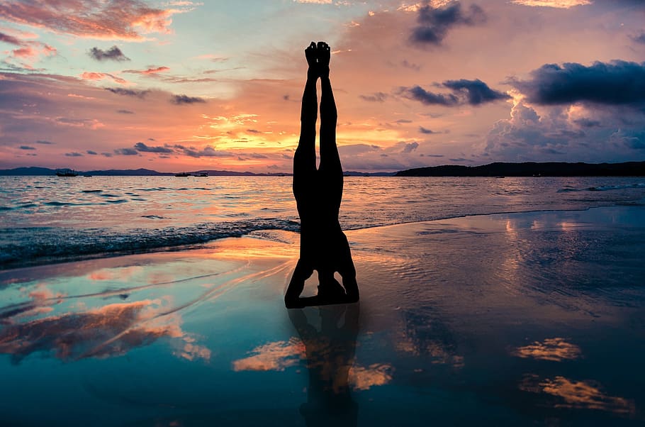 yoga stand in hands silhouette, sunset beach, zen position by the sea, yoga, pose, position, beach, exercise, sunset, fitness