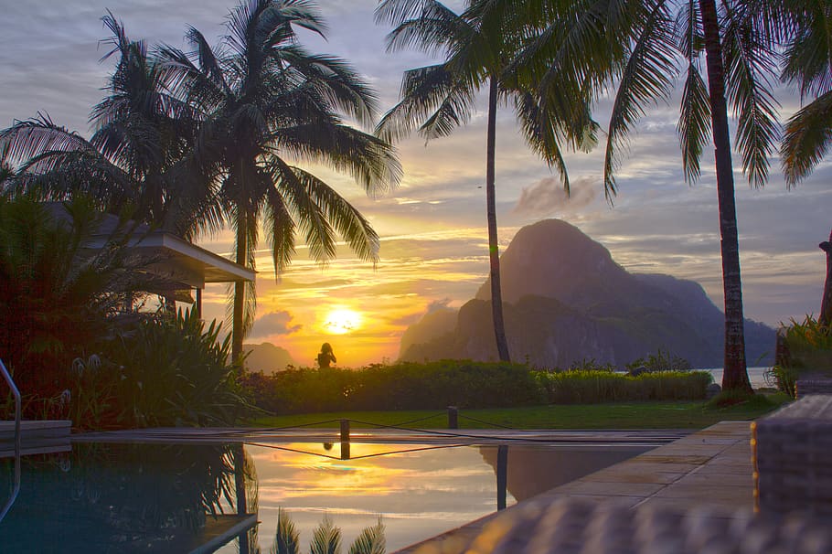 el nido, palawan, the philippines, cadlao resort, sunset, palms, pool, mountains, photography, evening