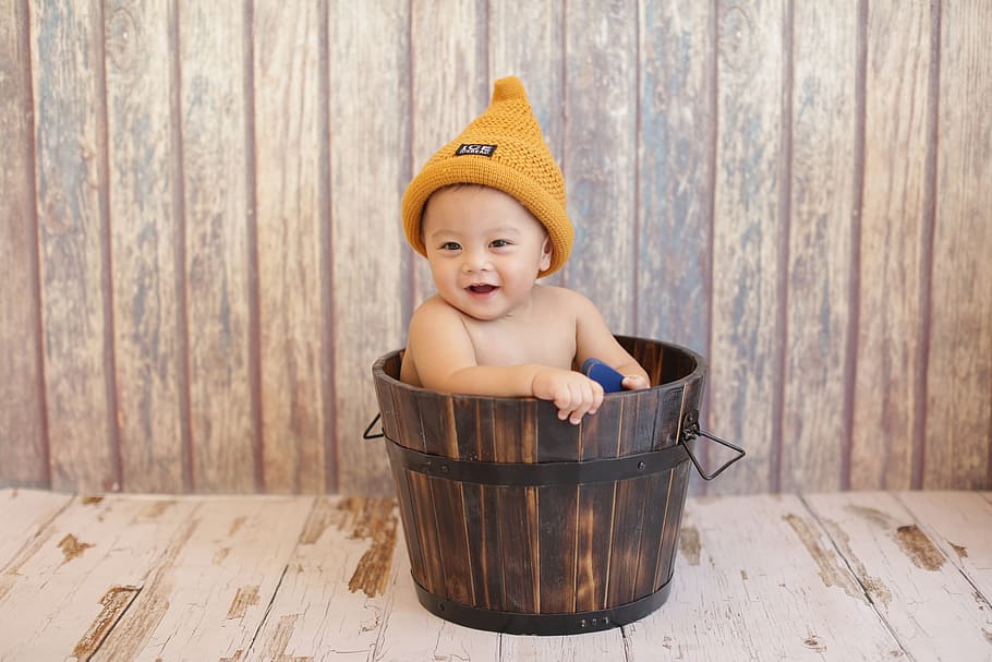 baby, hat, bucket, wood, child, childhood, wood - material, young, portrait, one person