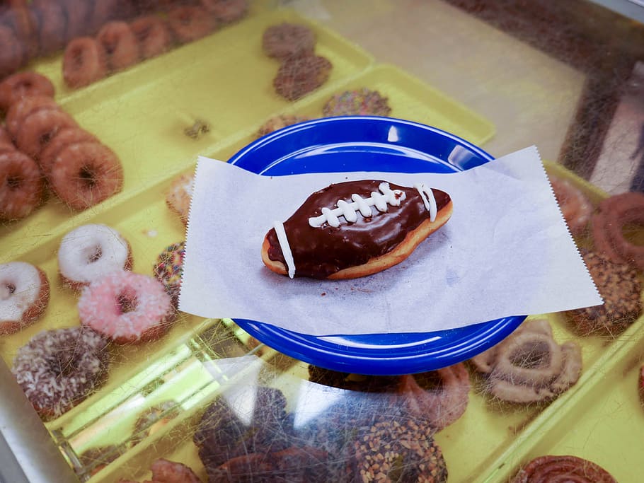 football, shaped, donut, sitting, blue, plate., bakery, breakfast, calories, chocolate