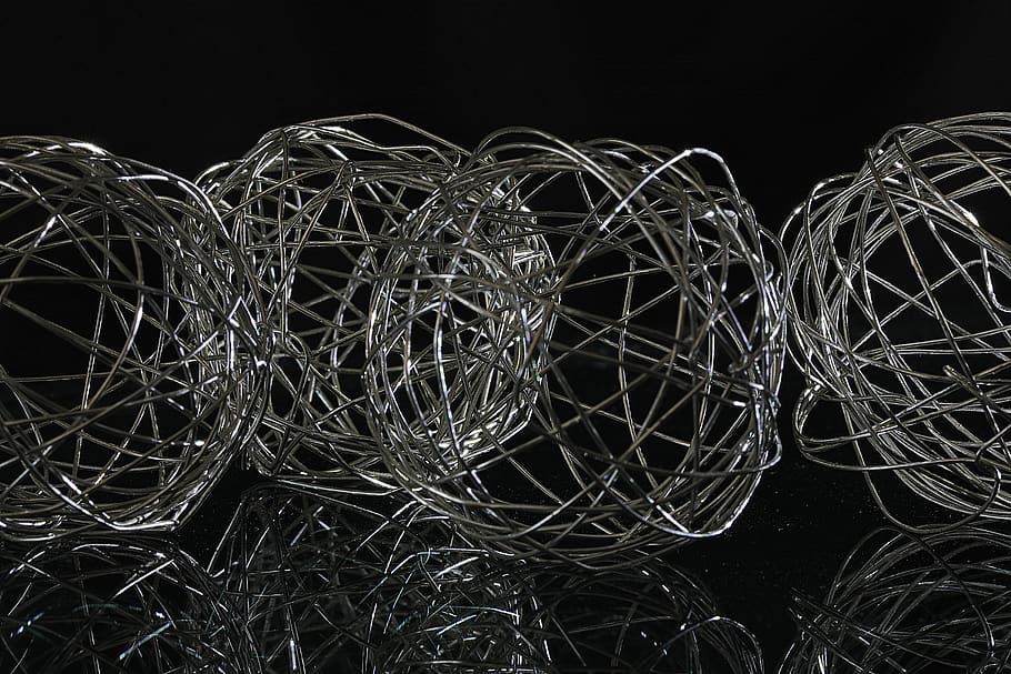 balls, wire, metal, silver, decoration, braid, confusion, chaos, black background, studio shot