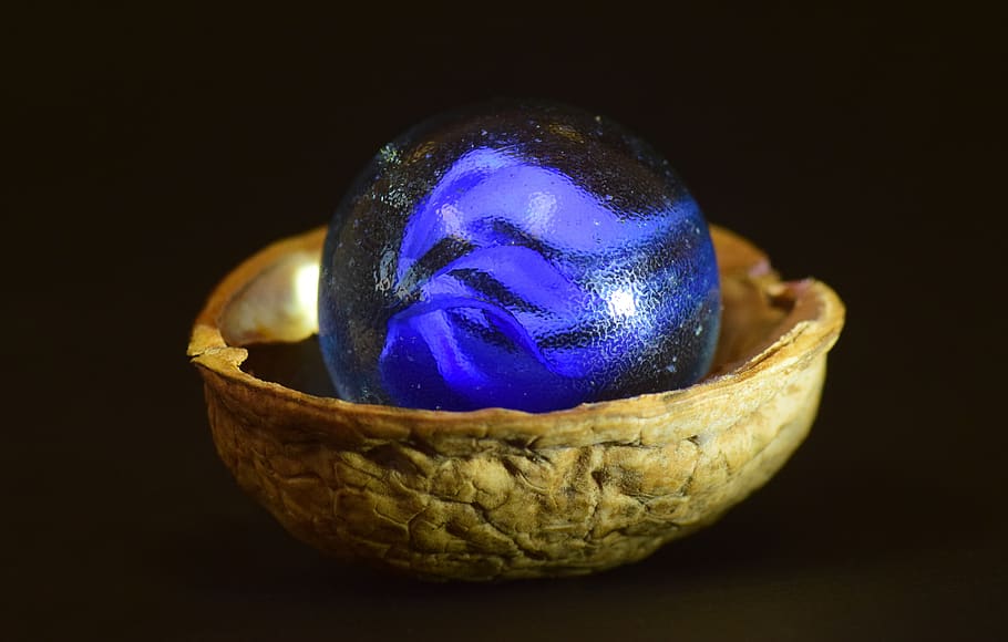 marble, nutshell, walnut shell, glass, wood, small, round, blue, shiny, glass marble