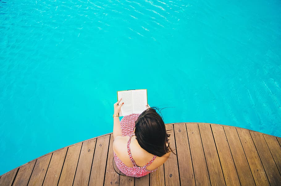 swimming, pool, blue, water, wooden, people, girl, woman, reading, book