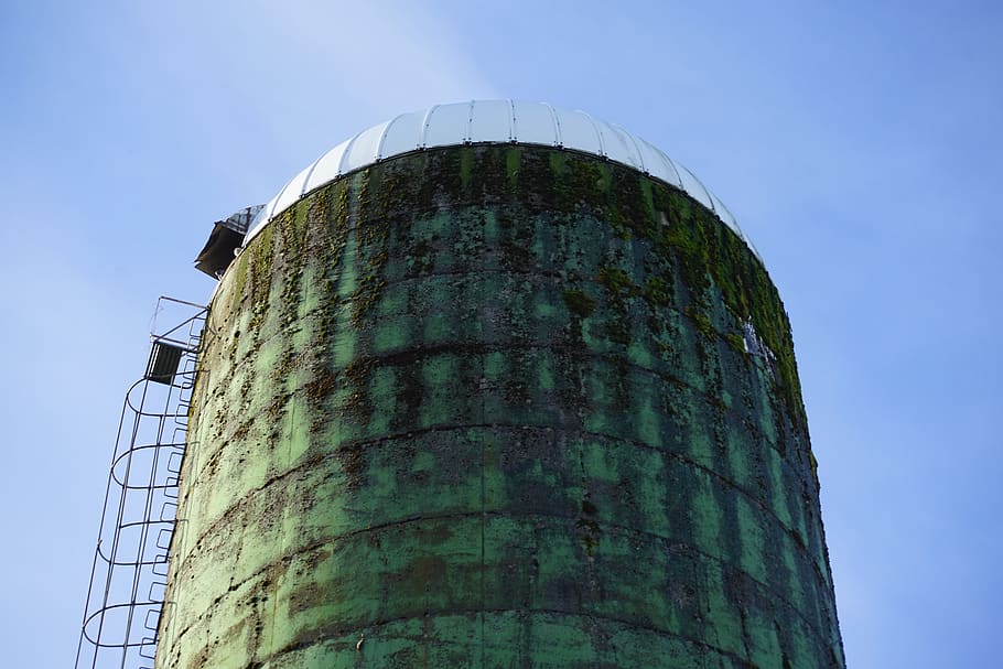 silo, farm, ranch, low angle view, architecture, built structure, factory, sky, building exterior, storage tank