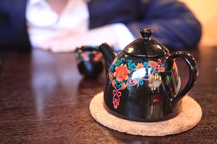 teapot, hand, close-up, table, focus on foreground, indoors, food and drink, drink, kettle, tea - hot drink