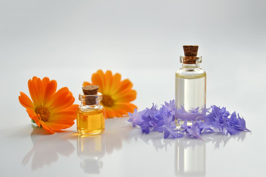 essential oil, spa, cosmetology, cosmetic oil, beauty, flowers, essential oils, glass bottle, calendula, petals