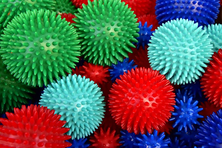 massage balls, hedgehog balls, barbed balls, colorful, background, plastic, green, red, blue, round