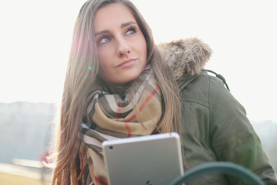 nice, girl, looks, around, tablet, hand, portrait, one person, winter, hair