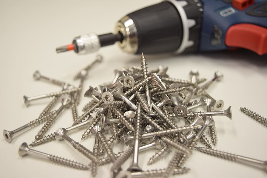 screws, electric drill, tools, metal, screw, still life, large group of objects, indoors, selective focus, close-up