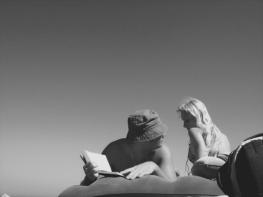Man, women, sunbathing, black, white, people, reading, holiday, tourists, relax