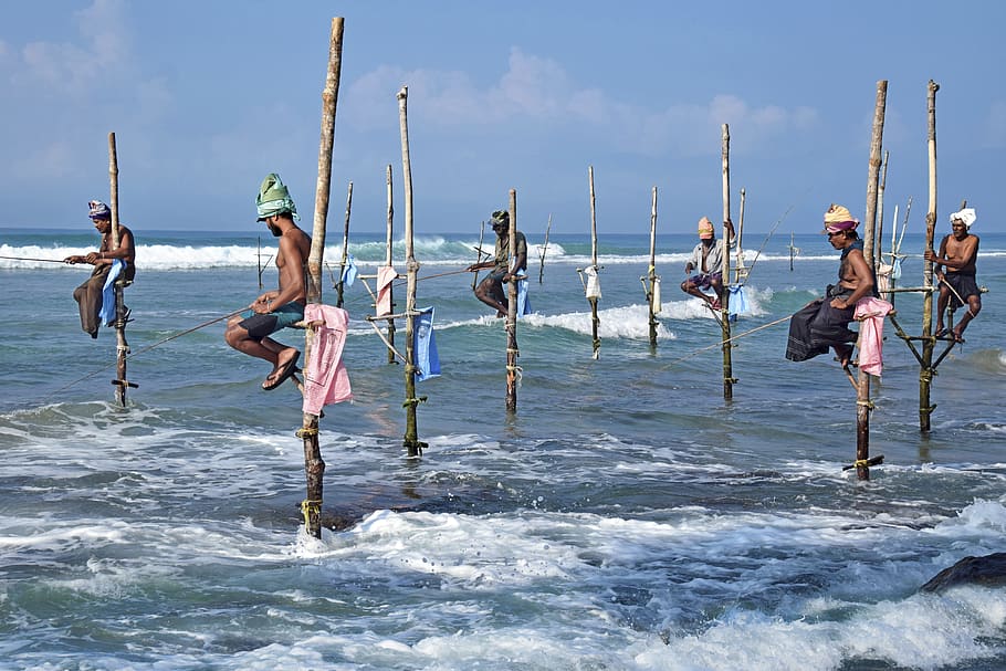 travel living, sea, lifestyle, culture, fishing, stilt fishing, water, sky, group of people, leisure activity