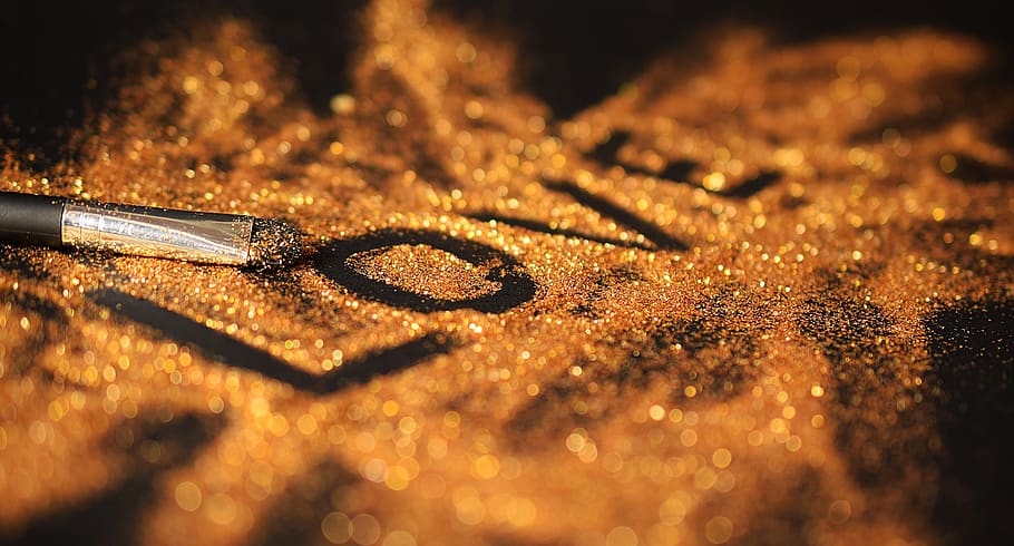 the inscription, love, black, gold, selective focus, close-up, gold colored, indoors, jewelry, sunlight