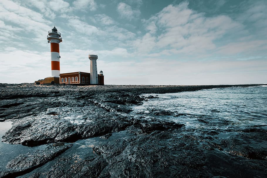 lighthouse, sea, day, ocean, water, sky, rocks, building, architecture, guidance