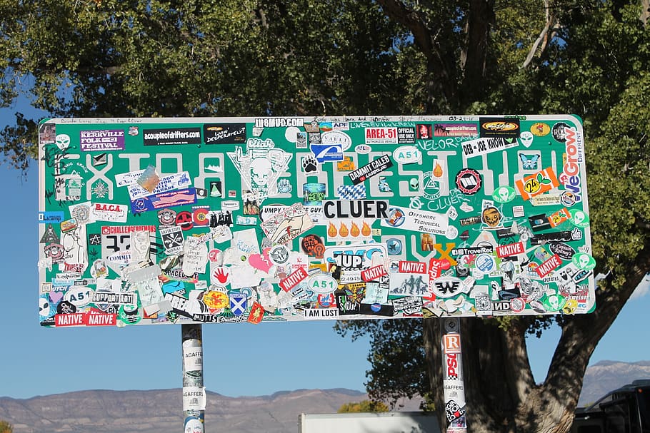 sticker, extraterrestrial highway, nevada, area 51, ufo, nv-375, travel, tourism, text, tree
